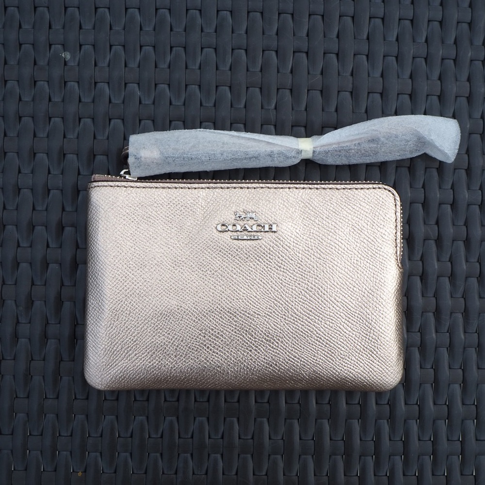 COACH Wristlet. Gold